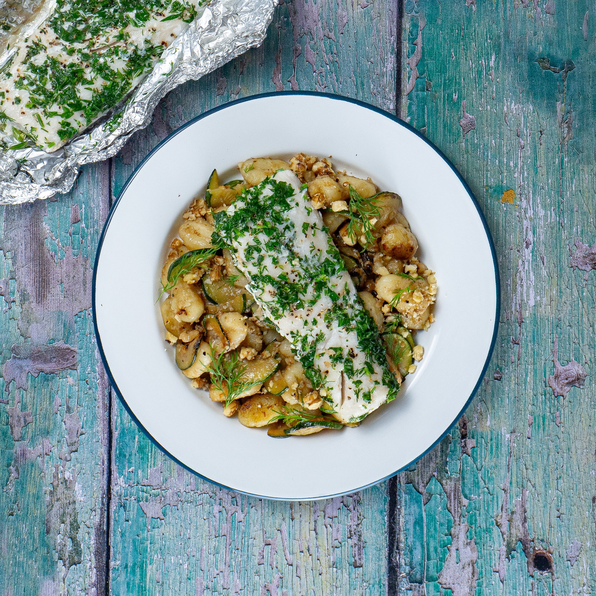 Herby Hake en Papillote with Garlic & Courgette Crispy Gnocchi
